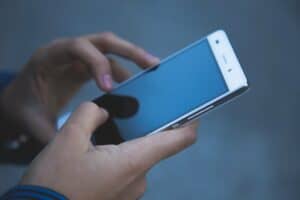 a man holding one of the degoogled Phones