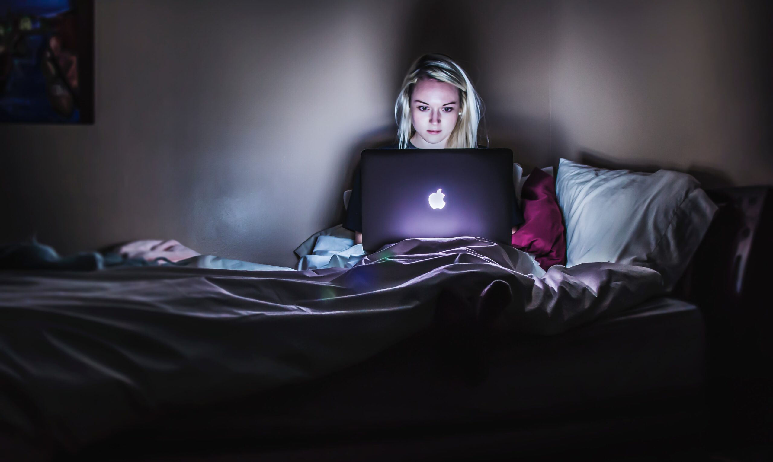 Girl using laptop securing her online privacy